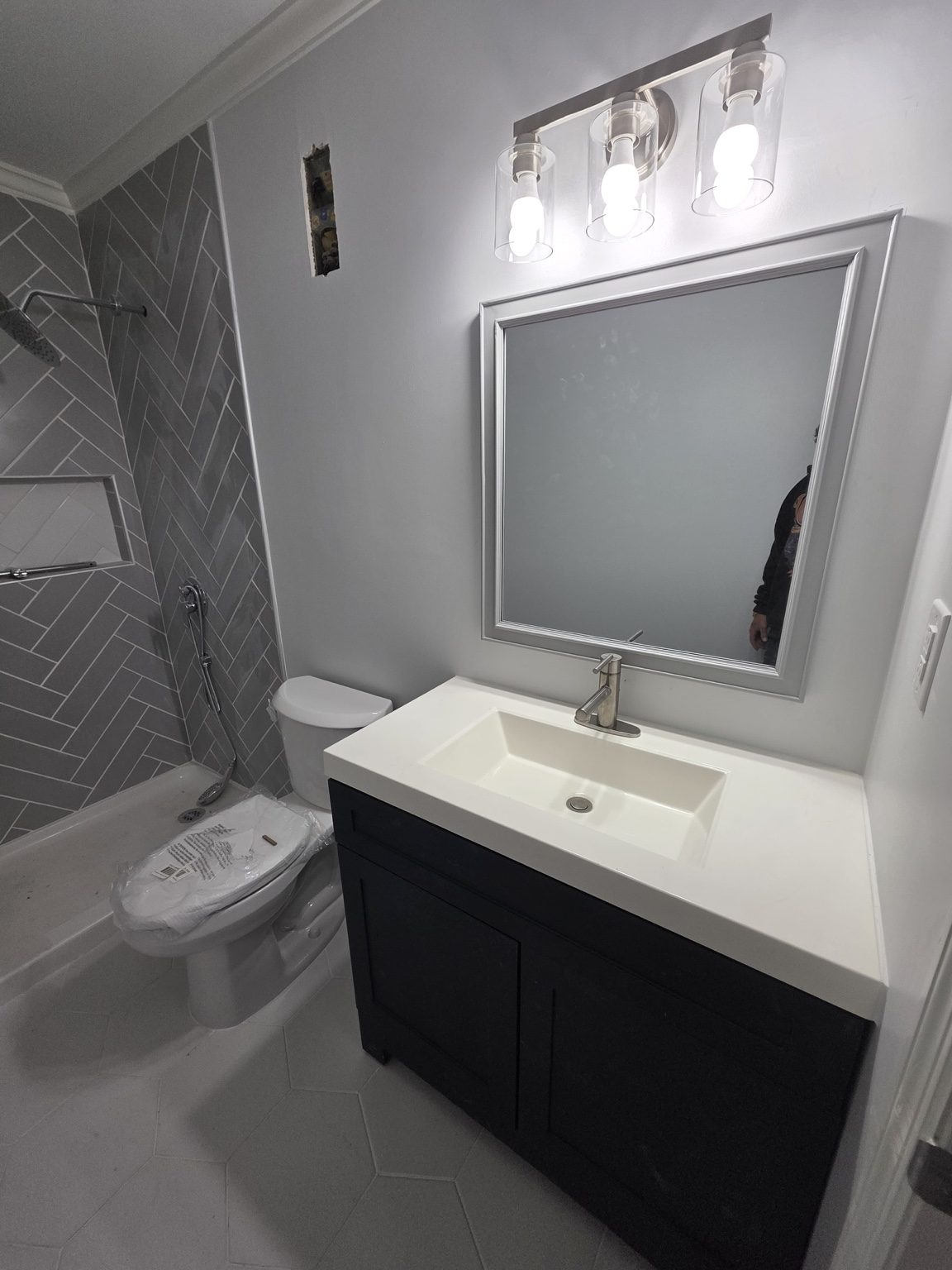 Bathroom renovation with modern tile and vanity