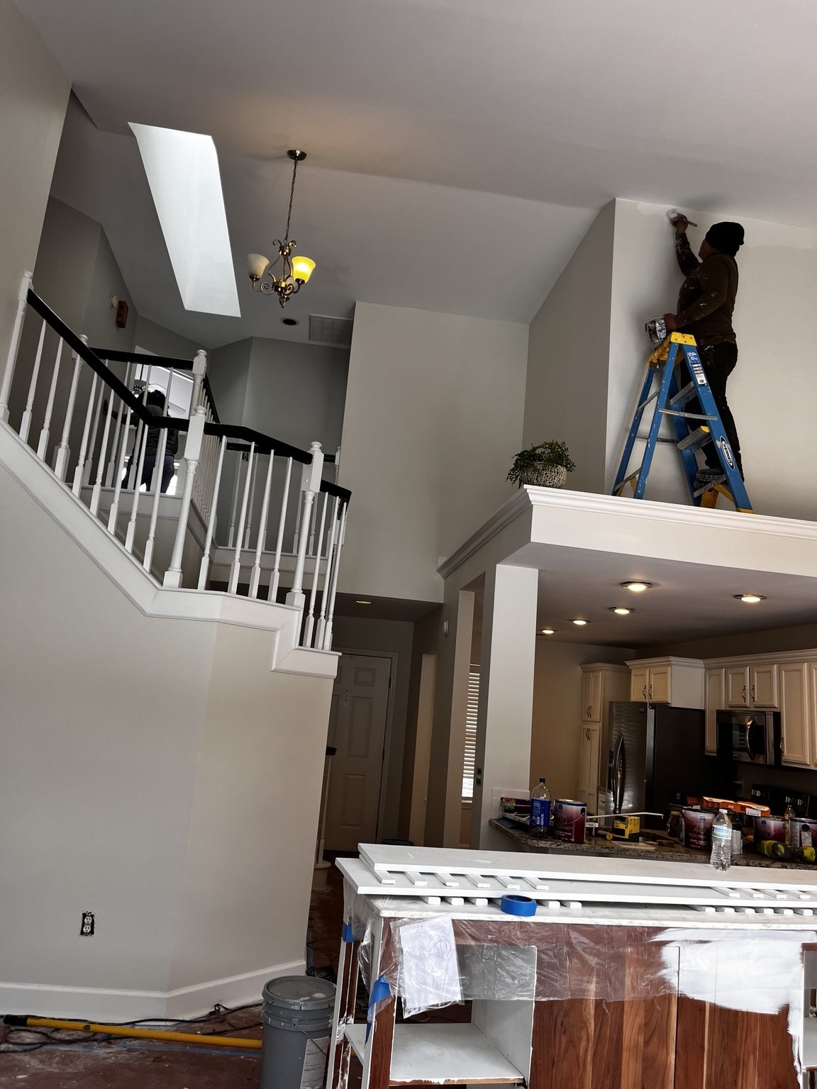 Interior painting in high ceiling home